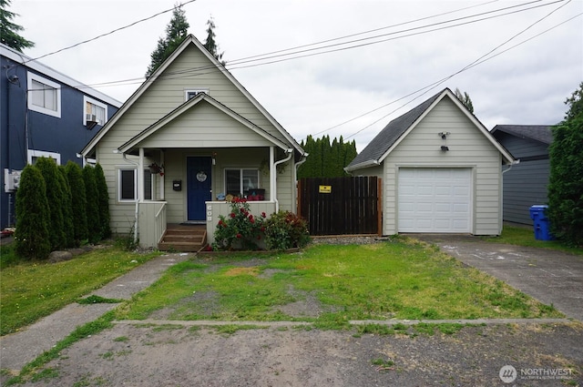 608 S 6th Ave, Kelso, WA 98626 - view of front of property featuring driveway, a detached garage, a porch, and an outdoor structure