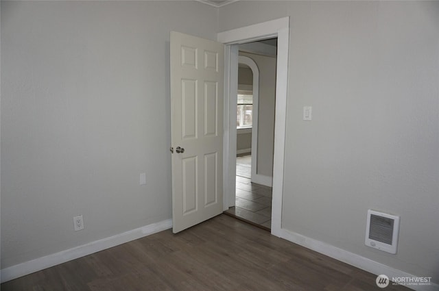 608 S 6th Ave, Kelso, WA 98626 - spare room featuring arched walkways and dark wood-style floors