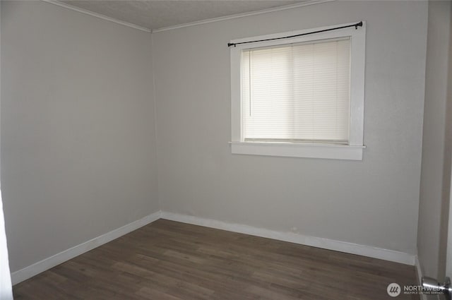 608 S 6th Ave, Kelso, WA 98626 - spare room featuring dark wood-style floors and crown molding