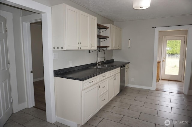 608 S 6th Ave, Kelso, WA 98626 - kitchen with dishwasher, open shelves, dark countertops, white cabinets, and a textured ceiling