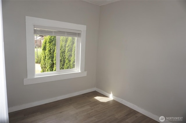 608 S 6th Ave, Kelso, WA 98626 - spare room with healthy amount of natural light and dark wood-style flooring