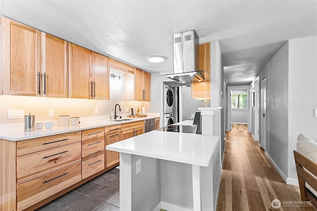 3104 Bill Mcdonald Pkwy Unit D104, Bellingham, WA 98225 - kitchen featuring stacked washer and clothes dryer, island exhaust hood, light brown cabinets, a textured ceiling, and dishwasher