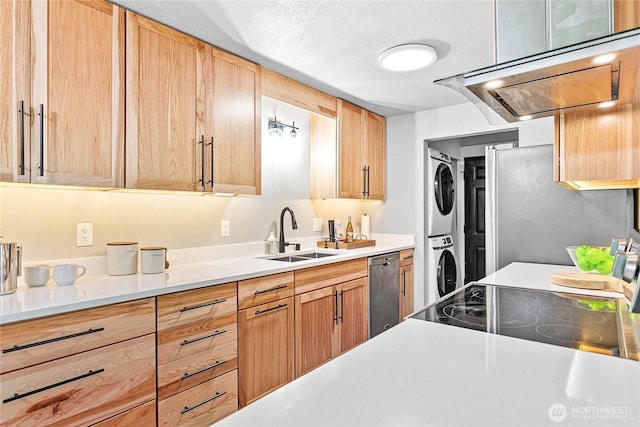 3104 Bill Mcdonald Pkwy Unit D104, Bellingham, WA 98225 - kitchen with stacked washer / drying machine, stainless steel appliances, light brown cabinetry, and light countertops