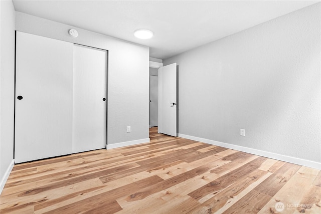 3104 Bill Mcdonald Pkwy Unit D104, Bellingham, WA 98225 - unfurnished bedroom featuring wood finished floors and a closet