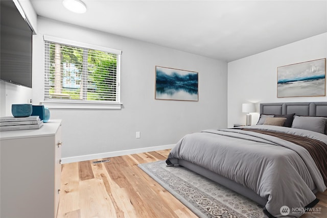 3104 Bill Mcdonald Pkwy Unit D104, Bellingham, WA 98225 - bedroom featuring baseboards and light wood finished floors