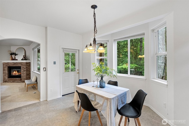 7506 Hawkstone Ave SW, Port Orchard, WA 98367 - dining area featuring a fireplace and light tile patterned floors