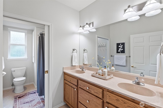 7506 Hawkstone Ave SW, Port Orchard, WA 98367 - bathroom featuring double vanity and toilet