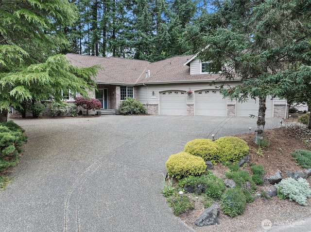 7506 Hawkstone Ave SW, Port Orchard, WA 98367 - view of front of property featuring brick siding, asphalt driveway, an attached garage, and roof with shingles
