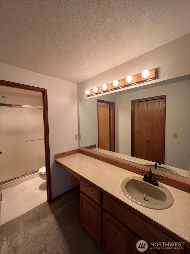7908 53rd St W, University Place, WA 98467 - bathroom with a shower stall, vanity, and a textured ceiling