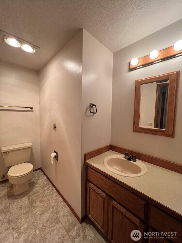 7908 53rd St W, University Place, WA 98467 - bathroom with vanity and a textured ceiling