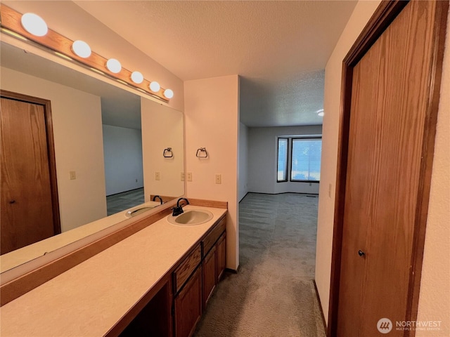 7908 53rd St W, University Place, WA 98467 - bathroom featuring a textured ceiling and vanity
