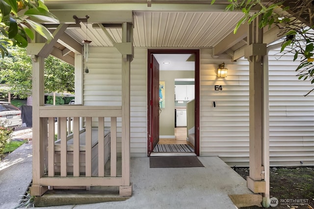 15600 116th Ave NE Unit E4, Bothell, WA 98011 - doorway to property featuring a porch