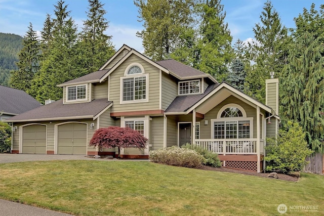 1125 Hemlock Ave SW, North Bend, WA 98045 - traditional-style house featuring driveway, a chimney, a shingled roof, and a garage