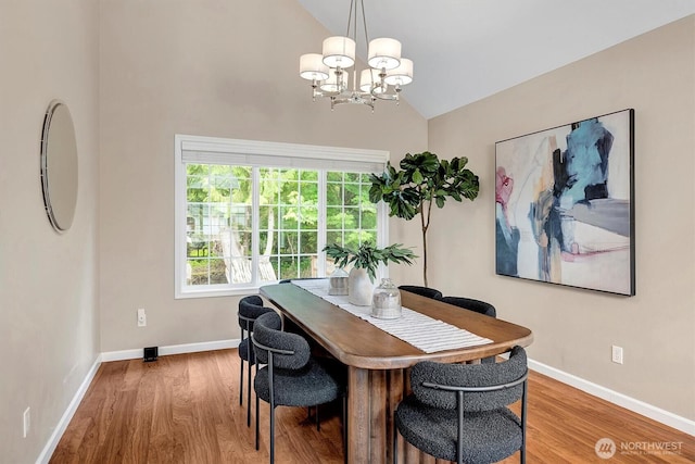 1125 Hemlock Ave SW, North Bend, WA 98045 - dining room with a chandelier, wood finished floors, and high vaulted ceiling