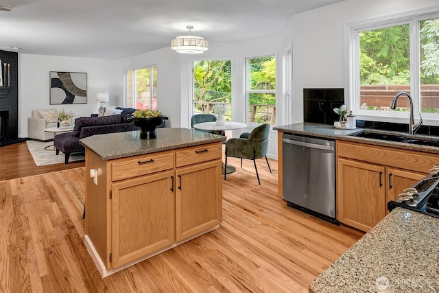 1125 Hemlock Ave SW, North Bend, WA 98045 - kitchen with dishwasher, light wood finished floors, a center island, and open floor plan