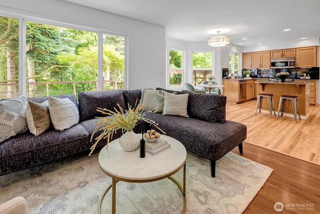 1125 Hemlock Ave SW, North Bend, WA 98045 - living room with light wood finished floors and recessed lighting