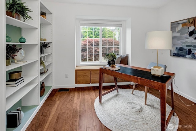 1125 Hemlock Ave SW, North Bend, WA 98045 - home office featuring baseboards and dark wood-style flooring