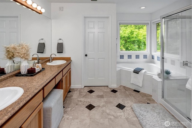1125 Hemlock Ave SW, North Bend, WA 98045 - bathroom featuring double vanity, a garden tub, and a shower stall
