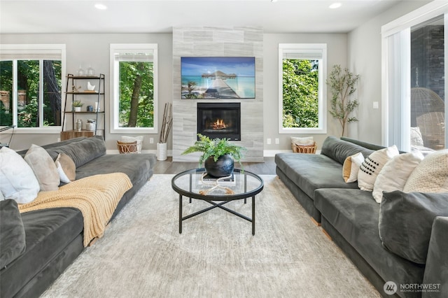 7223 NE 118th Ct, Kirkland, WA 98034 - living area with a tiled fireplace, recessed lighting, and wood finished floors