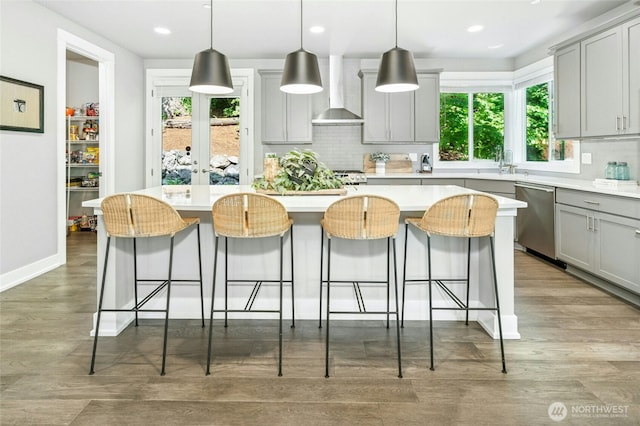 7223 NE 118th Ct, Kirkland, WA 98034 - kitchen featuring dishwasher, gray cabinets, backsplash, wall chimney exhaust hood, and recessed lighting