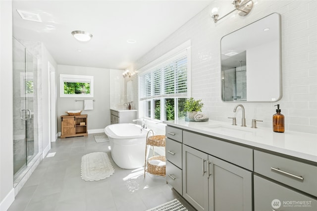 7223 NE 118th Ct, Kirkland, WA 98034 - bathroom with a stall shower, vanity, a freestanding tub, and tasteful backsplash