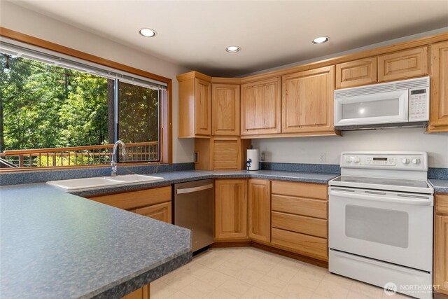 16537 Lakeview Dr, Leavenworth, WA 98826 - kitchen with white appliances, recessed lighting, and dark countertops