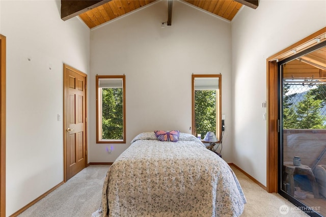 16537 Lakeview Dr, Leavenworth, WA 98826 - bedroom with light colored carpet, access to exterior, high vaulted ceiling, and a wooden ceiling with exposed beams