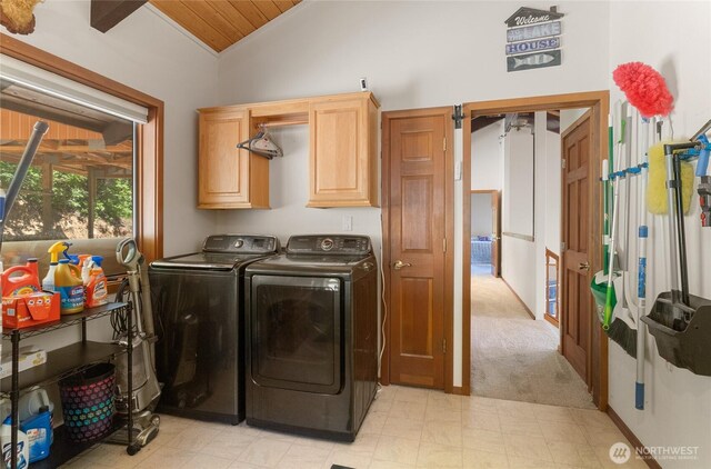 16537 Lakeview Dr, Leavenworth, WA 98826 - laundry room featuring washer and clothes dryer, cabinet space, light colored carpet, and wooden ceiling