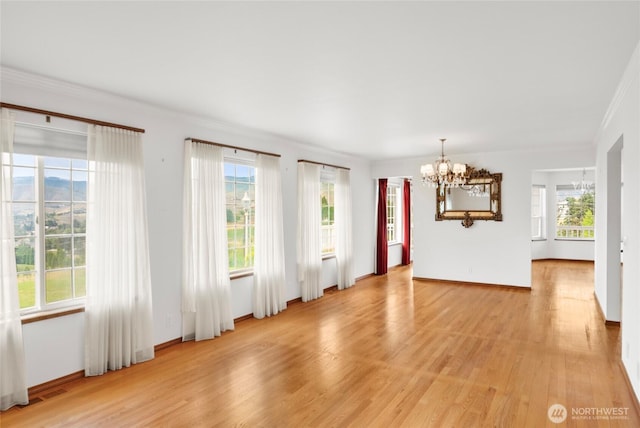 3505 Kimberly Ct, Wenatchee, WA 98801 - empty room with a chandelier, light wood finished floors, and crown molding
