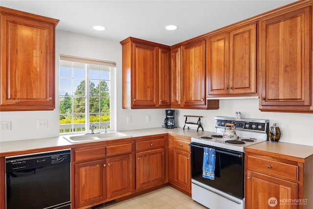 3505 Kimberly Ct, Wenatchee, WA 98801 - kitchen featuring black dishwasher, range with electric cooktop, light countertops, brown cabinetry, and recessed lighting