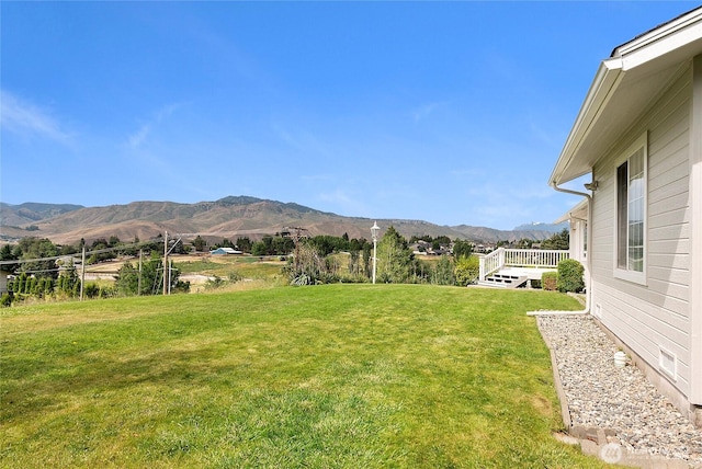 3505 Kimberly Ct, Wenatchee, WA 98801 - view of green lawn with a deck with mountain view