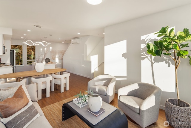 2749 Clare Ave Unit 1, Bremerton, WA 98310 - living room featuring light wood-style flooring, recessed lighting, and an AC wall unit