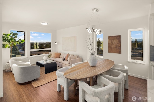2749 Clare Ave Unit 1, Bremerton, WA 98310 - dining space with healthy amount of natural light, wood finished floors, and a chandelier