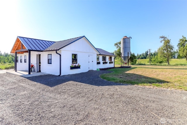 14045 Solberg Rd SE, Yelm, WA 98597 - back of house with a standing seam roof, a metal roof, and board and batten siding