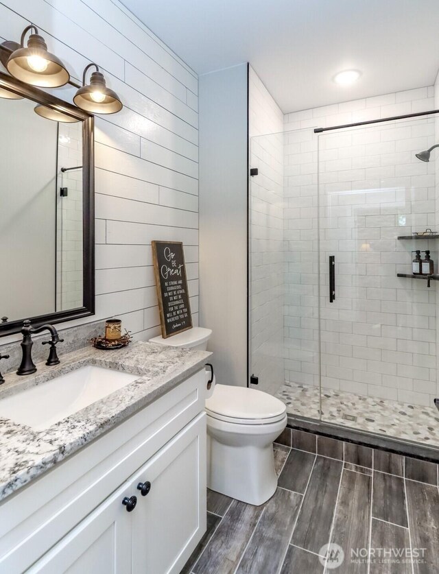 14045 Solberg Rd SE, Yelm, WA 98597 - bathroom featuring vanity, wood finished floors, and a shower stall