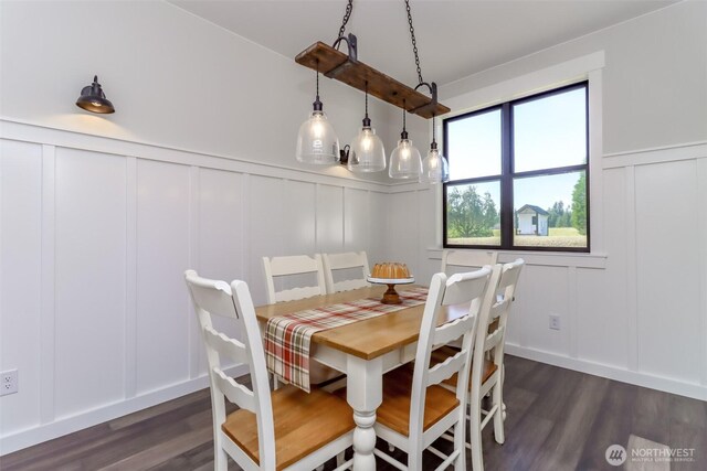 14045 Solberg Rd SE, Yelm, WA 98597 - dining area with a decorative wall, dark wood-style floors, and wainscoting