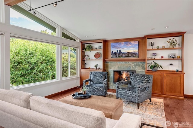 5829 112th Pl NE, Kirkland, WA 98033 - living room with lofted ceiling, light wood-style flooring, and a fireplace