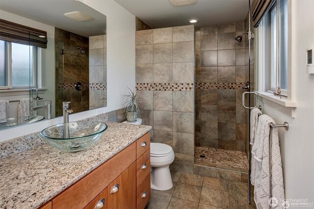5829 112th Pl NE, Kirkland, WA 98033 - bathroom with a tile shower, vanity, stone finish flooring, and recessed lighting