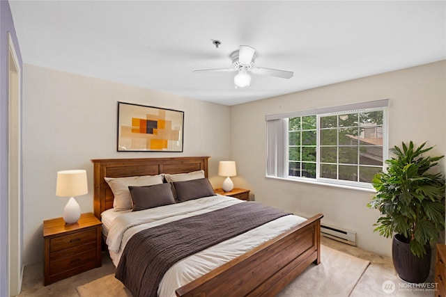 215 100th St SW Unit A305, Everett, WA 98204 - bedroom featuring a baseboard radiator, light colored carpet, and a ceiling fan