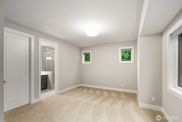 4229 95th Ave NE, Yarrow Point, WA 98004 - unfurnished bedroom featuring light colored carpet and connected bathroom