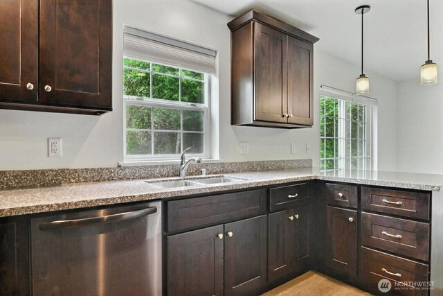 237 SW Oak Rd, Port Orchard, WA 98367 - kitchen with dishwasher, healthy amount of natural light, dark brown cabinetry, and hanging light fixtures