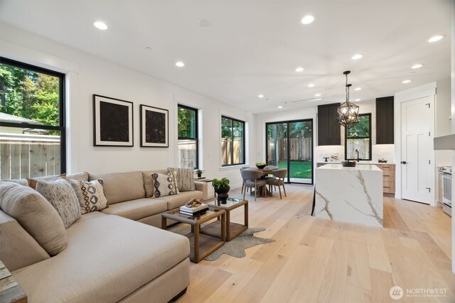13005 NE 88th St, Kirkland, WA 98033 - living room featuring recessed lighting and light wood-style flooring