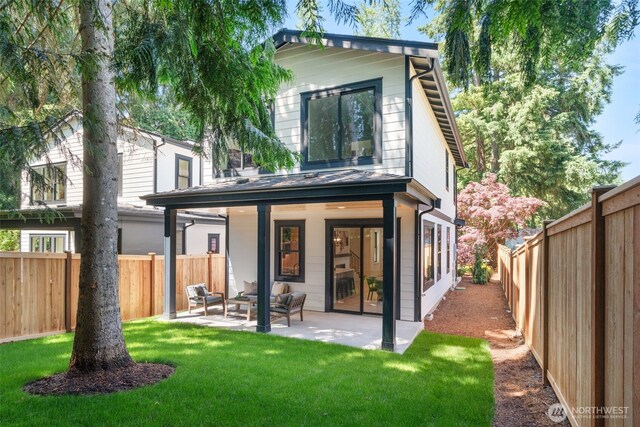 13005 NE 88th St, Kirkland, WA 98033 - rear view of house with a fenced backyard, a patio, and outdoor lounge area
