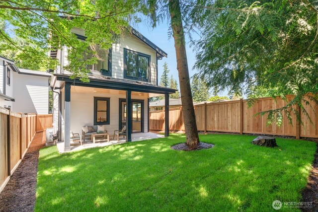 13005 NE 88th St, Kirkland, WA 98033 - rear view of house with a fenced backyard, an outdoor living space, and a patio area