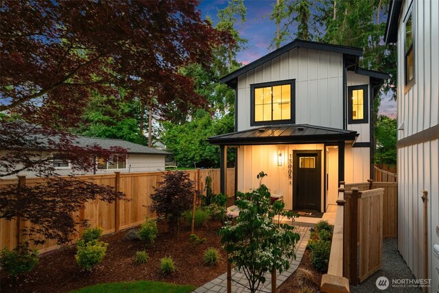 13005 NE 88th St, Kirkland, WA 98033 - view of front facade with a standing seam roof, board and batten siding, and a metal roof