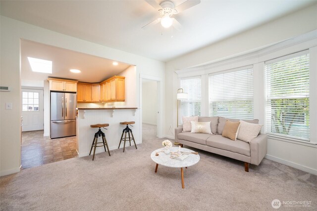 2226 King St, Bellingham, WA 98225 - living room with light colored carpet and a ceiling fan