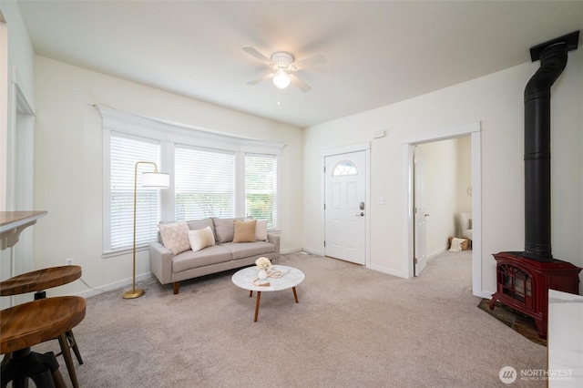 2226 King St, Bellingham, WA 98225 - carpeted living area with a wood stove and ceiling fan