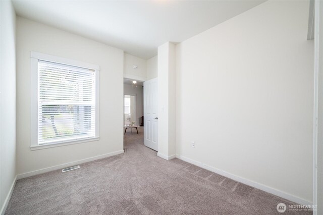 2226 King St, Bellingham, WA 98225 - unfurnished bedroom with carpet flooring and multiple windows