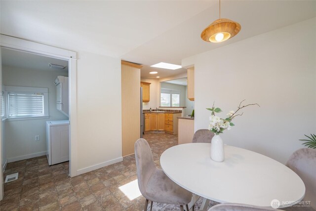 2226 King St, Bellingham, WA 98225 - dining room featuring stone finish flooring and washer / dryer