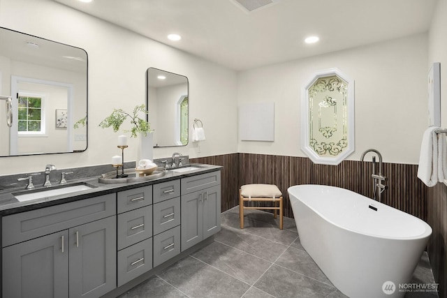 2892 160th Pl NE, Bellevue, WA 98008 - full bathroom with a wainscoted wall, double vanity, a soaking tub, recessed lighting, and wood walls